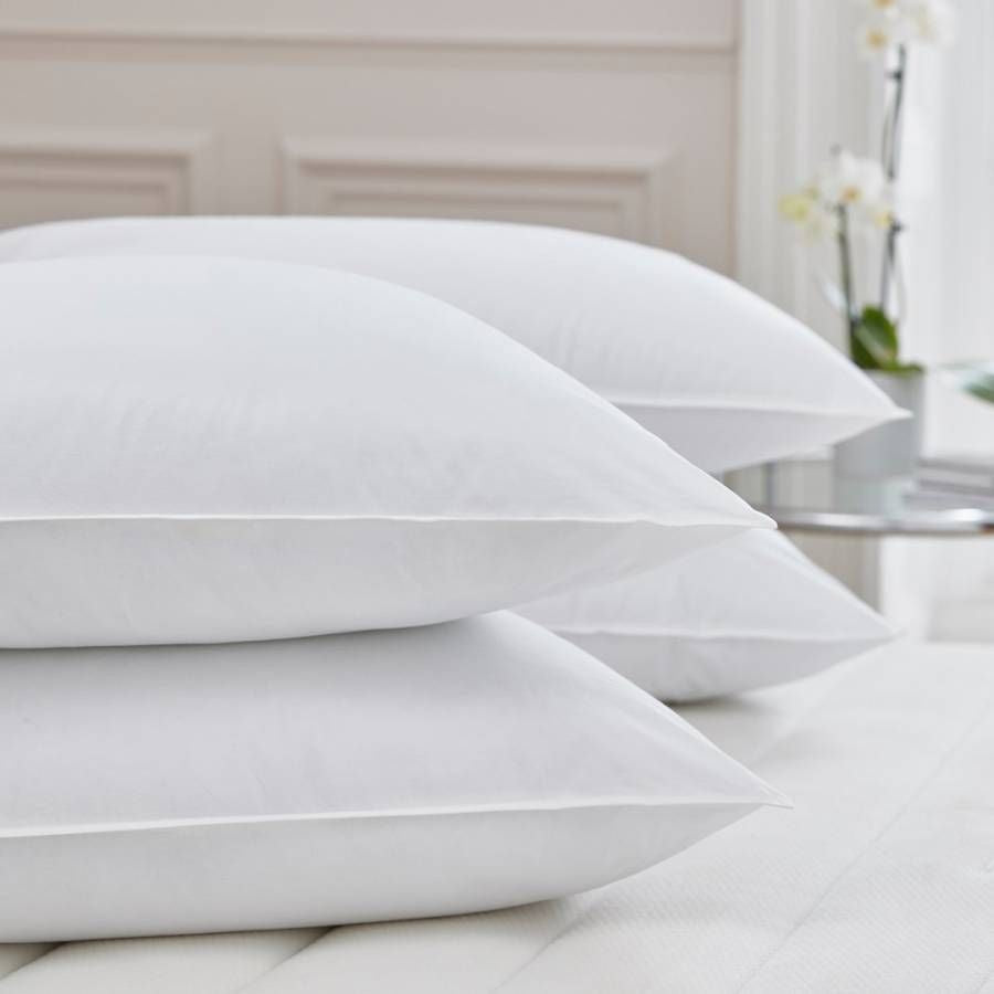 Four crisp white pillows