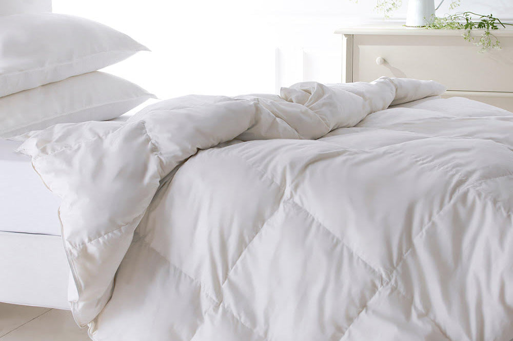 White Goose Down Duvet with two pillows on a bed