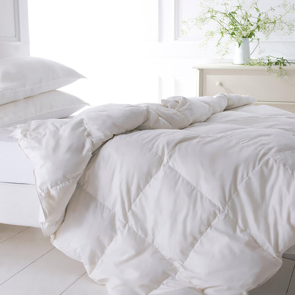 White Goose Down Duvet with two pillows on a bed