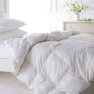 White Goose Down Duvet with two pillows on a bed
