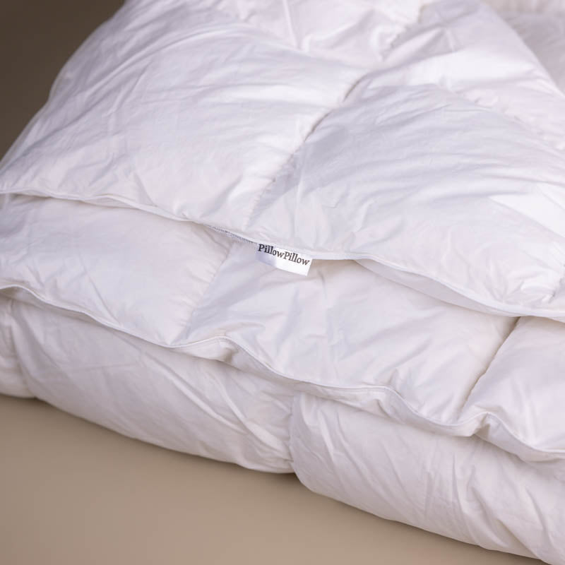 6 Tog White Goose Feather and Down Duvet with a neutral background