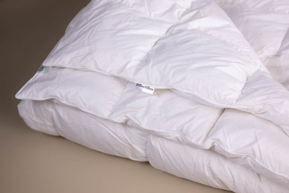6 Tog White Goose Feather and Down Duvet with a neutral background