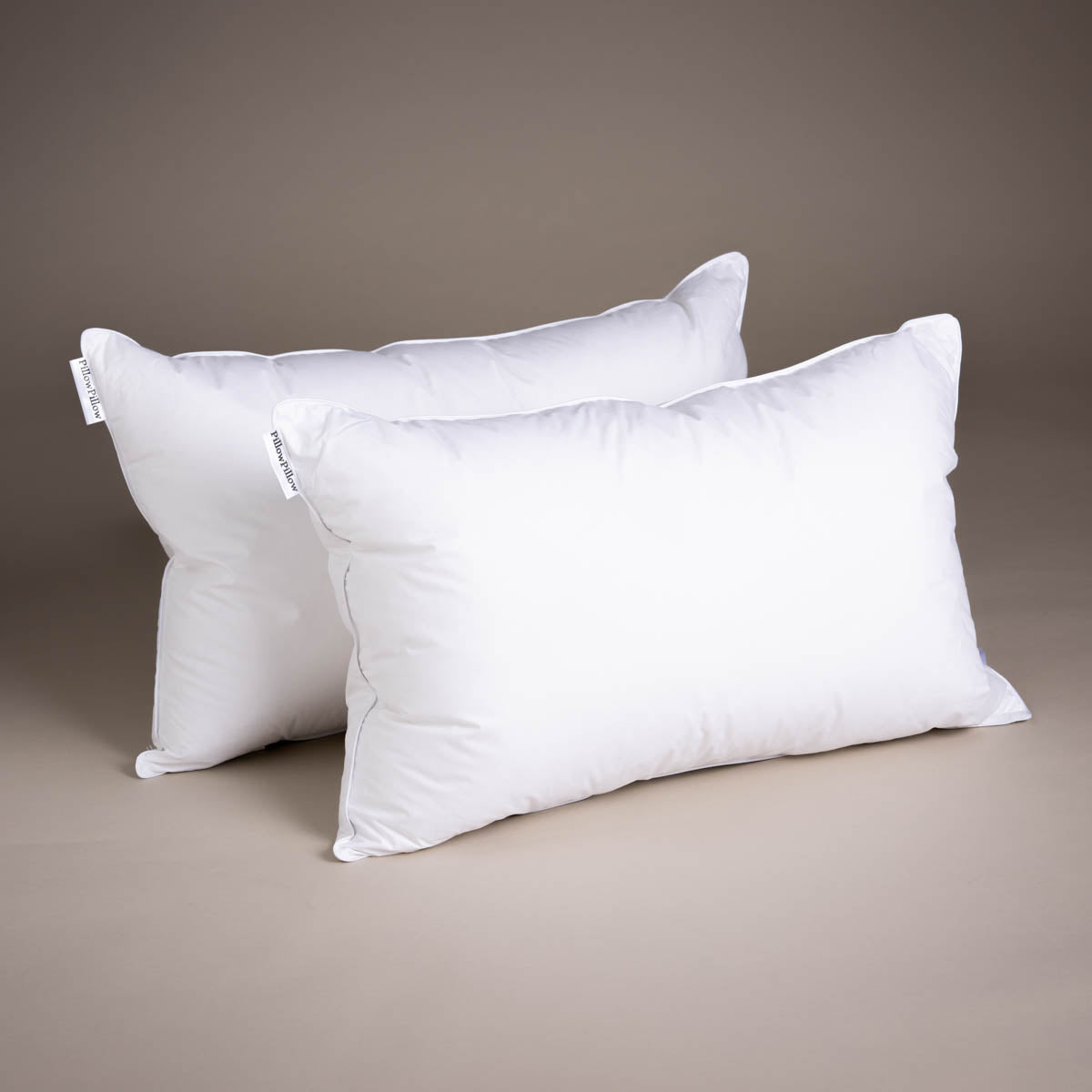 two White Duck Down Pillows on a neutral background