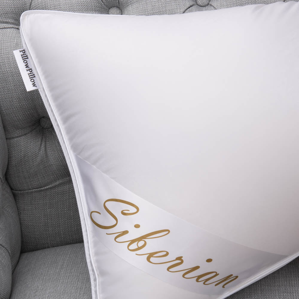 Silky smooth Siberian Super King Size pillow on a padded grey chair