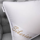 Silky smooth Siberian Super King Size pillow on a padded grey chair