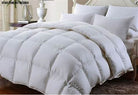 White Goose Down Duvet on a bed with four plump pillows