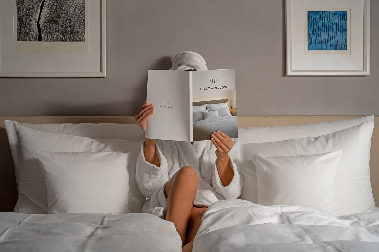 Guest relaxing in bed reading the PillowPillow brochure